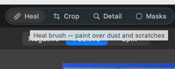 Negative Converter's toolbar with the Heal tool selected and its tooltip reading: Heal brush — paint over dust and scratches